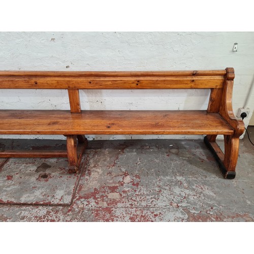 245 - A 19th century Augustus Pugin style pine church pew - approx. 80cm high x 265cm long x deep