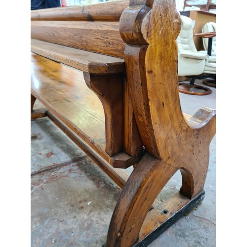 245 - A 19th century Augustus Pugin style pine church pew - approx. 80cm high x 265cm long x deep