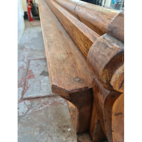 245 - A 19th century Augustus Pugin style pine church pew - approx. 80cm high x 265cm long x deep