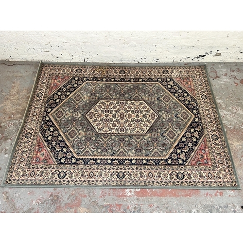 154 - A Royal Kirman 100% wool rug - approx. 200cm x 140cm