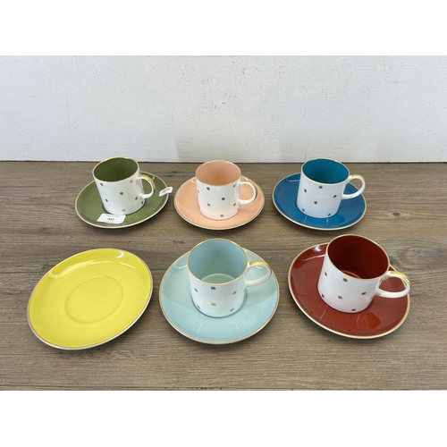 408 - Eleven pieces of Susie Cooper china, six saucers and five coffee cups