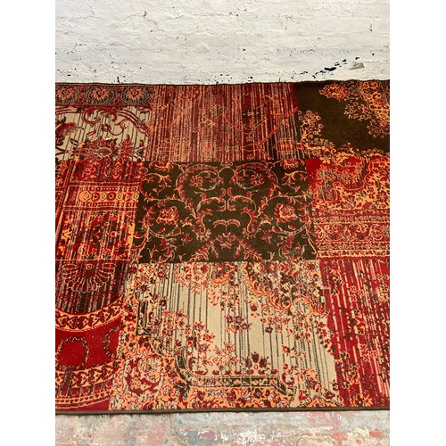 140 - A Kukoon red rug - approx. 280cm x 190cm