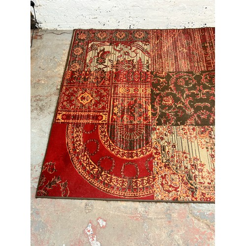 140 - A Kukoon red rug - approx. 280cm x 190cm