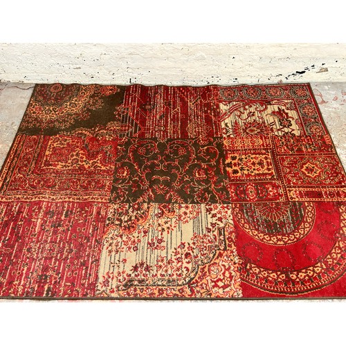 141 - A Kukoon red rug - approx. 280cm x 190cm