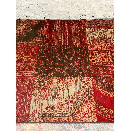 141 - A Kukoon red rug - approx. 280cm x 190cm