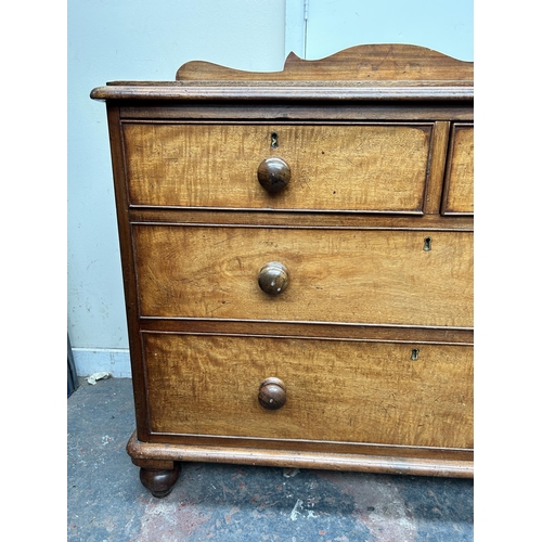 100 - A Victorian mahogany chest of two short over two long drawers with galleried back