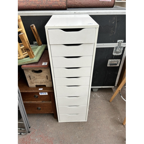 176 - A white laminate chest of nine drawers