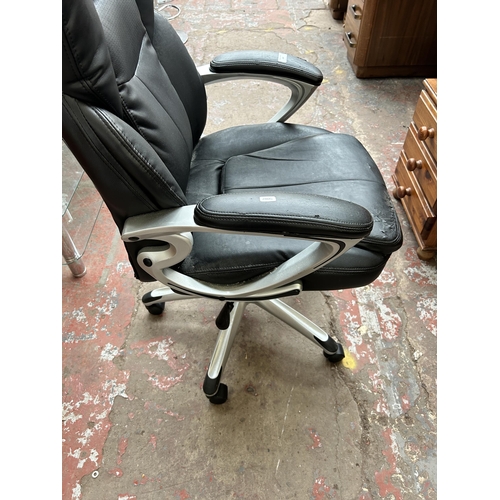 183 - A black leatherette and grey plastic swivel office desk chair