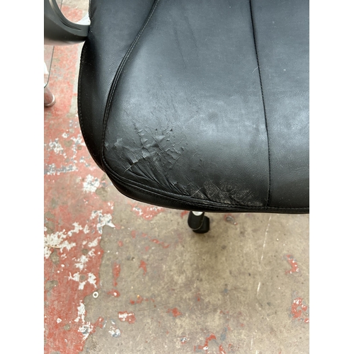 183 - A black leatherette and grey plastic swivel office desk chair