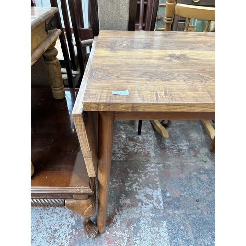 191 - A teak effect and beech drop leaf kitchen table