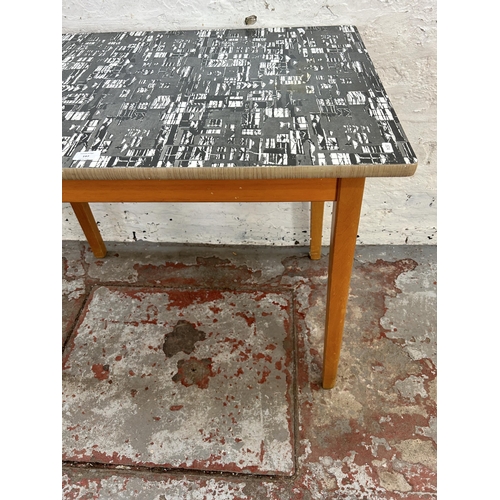 197 - A mid 20th century formica and beech rectangular kitchen table