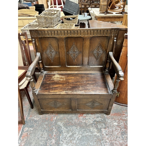 200 - A carved oak monk's bench