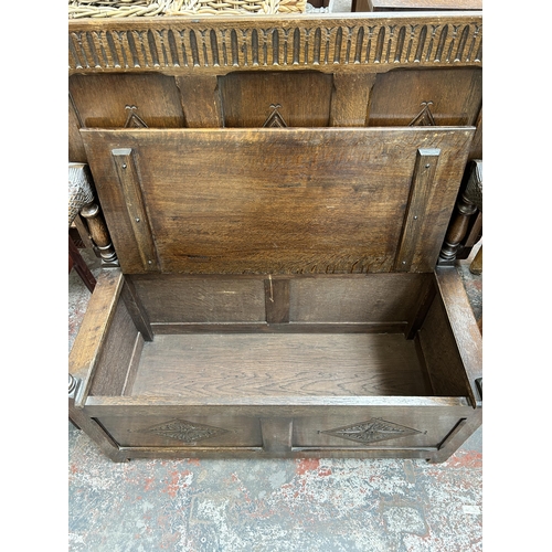 200 - A carved oak monk's bench