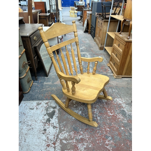 202 - A beech spindle back farmhouse rocking chair