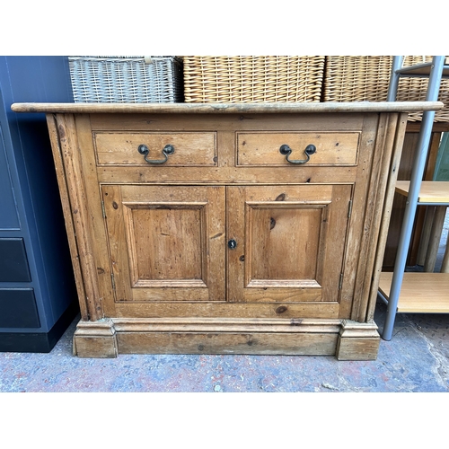 207 - A Victorian style solid pine sideboard with two drawers and two cupboard doors