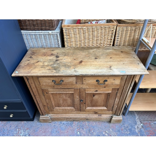 207 - A Victorian style solid pine sideboard with two drawers and two cupboard doors