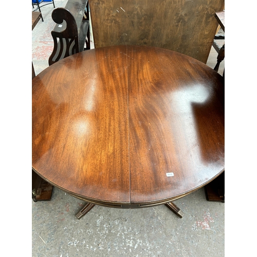 213 - A Bevan Funnell Ltd. Reprodux mahogany extending pedestal dining table