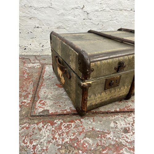 217 - An early 20th century snakeskin effect and wooden banded travel trunk