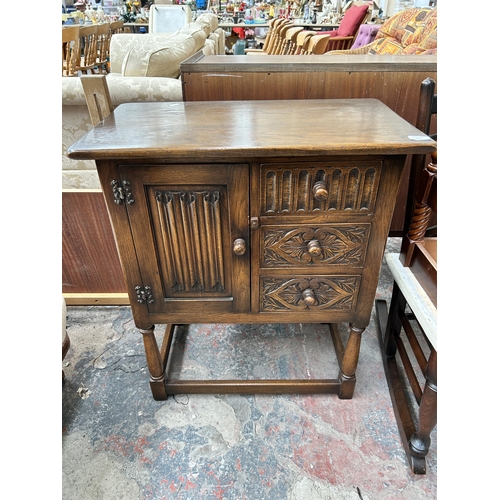 221 - Two pieces of furniture, one carved oak linenfold side cabinet and one Victorian carved rosewood din... 