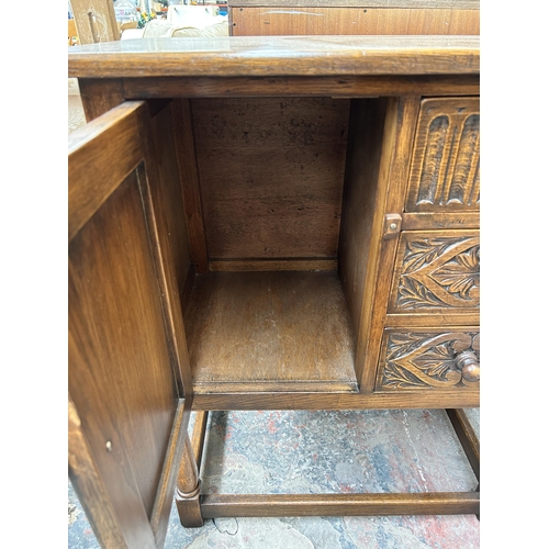 221 - Two pieces of furniture, one carved oak linenfold side cabinet and one Victorian carved rosewood din... 