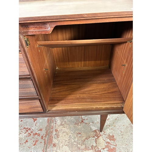 235 - A 1960s Richard Hornby for Fyne Ladye afromosia sideboard with four drawers and two cupboard doors -... 