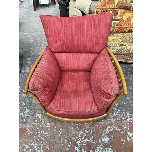 243 - An Ercol Renaissance elm and red fabric armchair