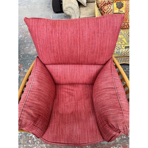 243 - An Ercol Renaissance elm and red fabric armchair