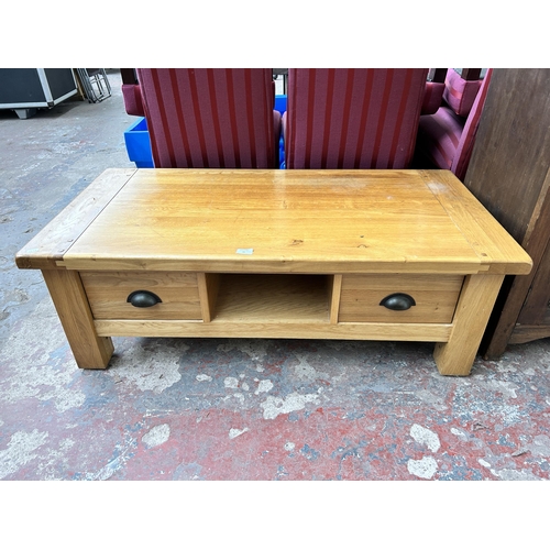 91 - A solid oak rectangular coffee table with two drawers