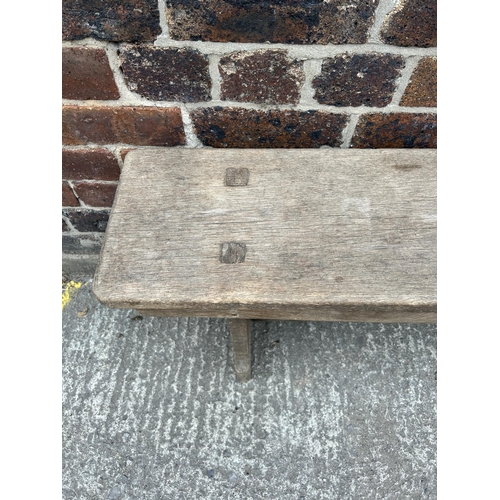 95 - An early 20th century oak bench - approx. 47cm high x 24cm wide x 244cm long
