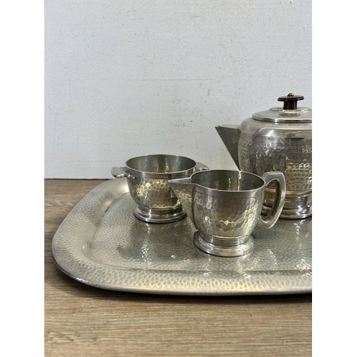 478 - A Craftsman Sheffield four piece hammered pewter coffee set