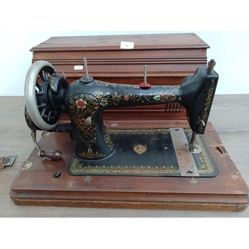 792 - A cased early 20th century Bradbury & Company Limited Medium V.S. manual sewing machine (serial numb... 