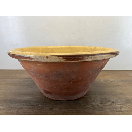 447B - A 19th century glazed terracotta dairy bowl - approx. 20cm high x 45cm diameter