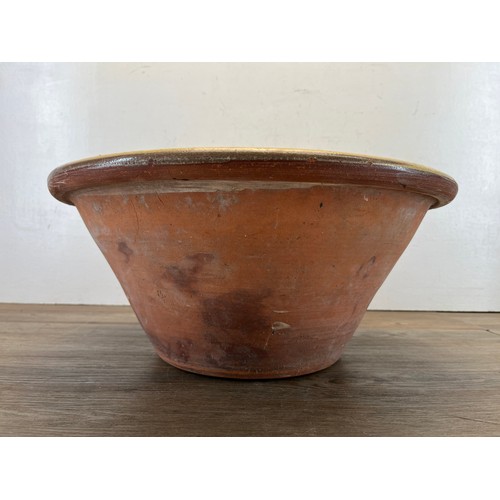 447B - A 19th century glazed terracotta dairy bowl - approx. 20cm high x 45cm diameter