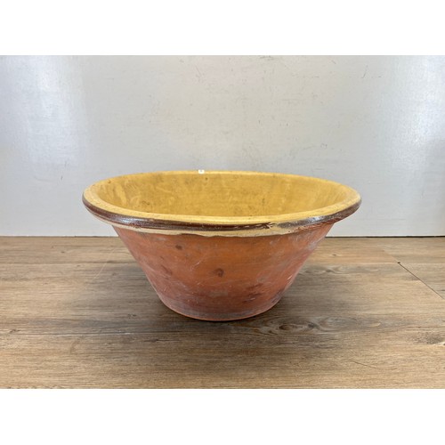 447B - A 19th century glazed terracotta dairy bowl - approx. 20cm high x 45cm diameter