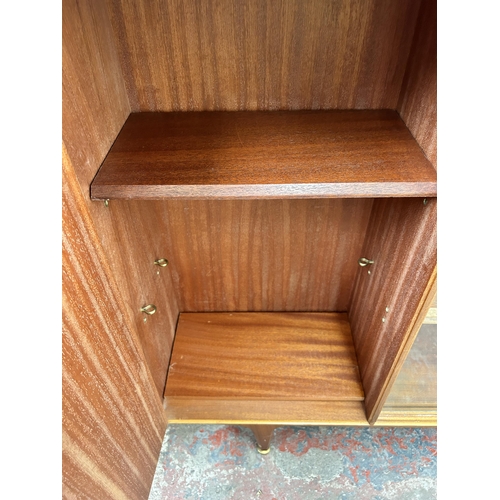103 - A McIntosh teak bookcase with two glass sliding doors