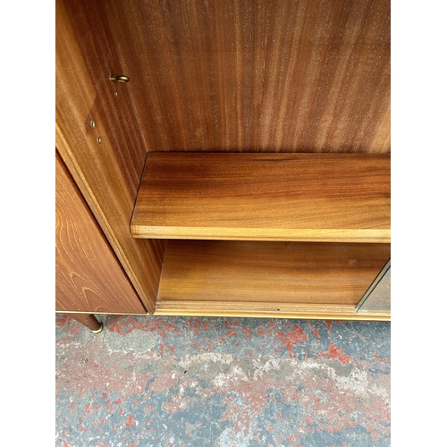 103 - A McIntosh teak bookcase with two glass sliding doors