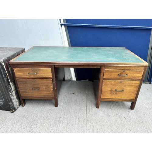 104A - A mid 20th century mahogany twin pedestal desk with green leather writing surface - approx. 71cm hig... 