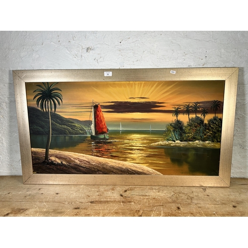 266 - A framed oil on board of a seascape - approx. 61cm high x 111cm wide