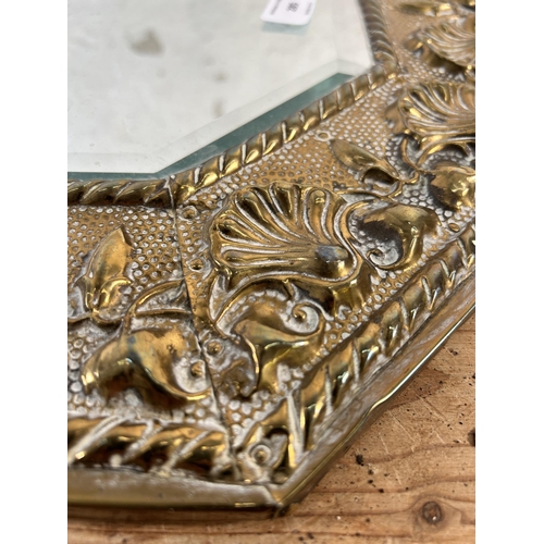 285 - An early/mid 20th century brass framed bevelled edge wall mirror - approx. 44cm high x 75cm wide