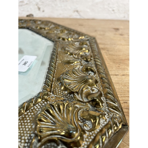 285 - An early/mid 20th century brass framed bevelled edge wall mirror - approx. 44cm high x 75cm wide