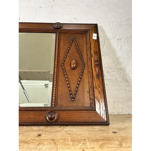 290 - An early 20th century carved and beaded oak framed bevelled edge wall mirror - approx. 54cm high x 9... 