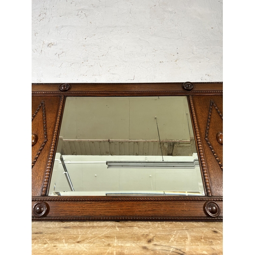 290 - An early 20th century carved and beaded oak framed bevelled edge wall mirror - approx. 54cm high x 9... 