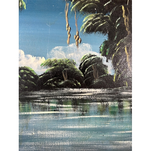 295 - A mid 20th century gilt framed oil on board of a jungle scene - approx. 43cm high x 56cm wide