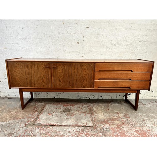 139 - An A. Younger Ltd. teak sideboard with three drawers and two cupboard doors