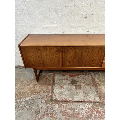 139 - An A. Younger Ltd. teak sideboard with three drawers and two cupboard doors