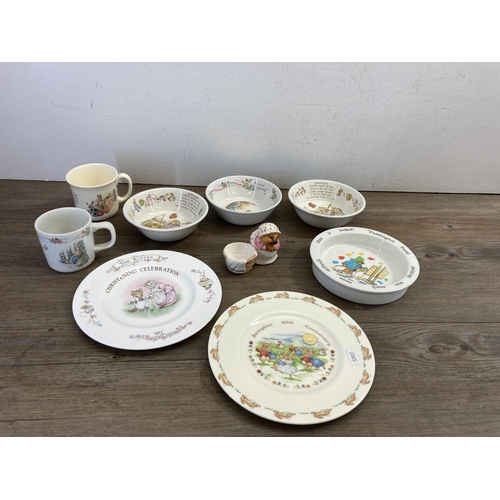 394 - A collection of ceramics to include two Coalport Paddington Bear bowls, Royal Doulton Bunnykins mone... 