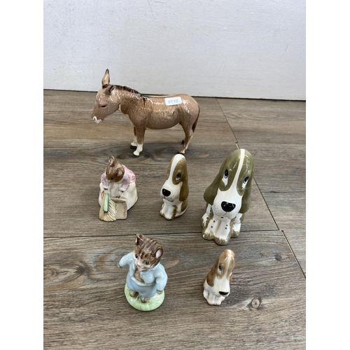 395 - Seventeen ceramic animal figurines to include two Beswick donkeys, Beswick no. 2026 barn owl, Beswic... 