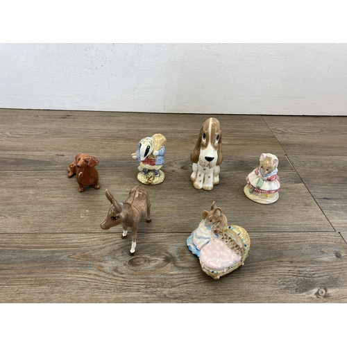 395 - Seventeen ceramic animal figurines to include two Beswick donkeys, Beswick no. 2026 barn owl, Beswic... 