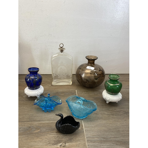 404 - A collection of Victorian and later glassware to include pair of John Walsh uranium and vaseline gla... 