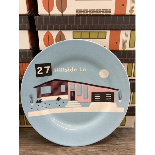 433 - Twenty one boxed Magpie Homestead plate sets